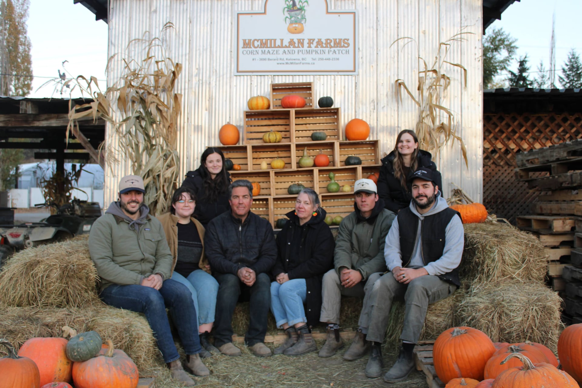 McMillan family standing shoulder to shoulder at a wedding
